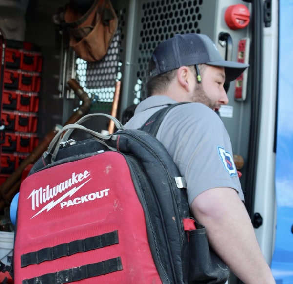 Domination Plumbing & Heating maintenance technician, heading to a service call in Worcester County, Massachusetts.